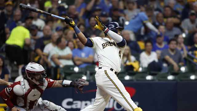 Oct 4, 2023; Milwaukee, Wisconsin, USA; Milwaukee Brewers first baseman Carlos Santana (41) hits a single in the third inning against the Arizona Diamondbacks during game two of the Wildcard series for the 2023 MLB playoffs at American Family Field.